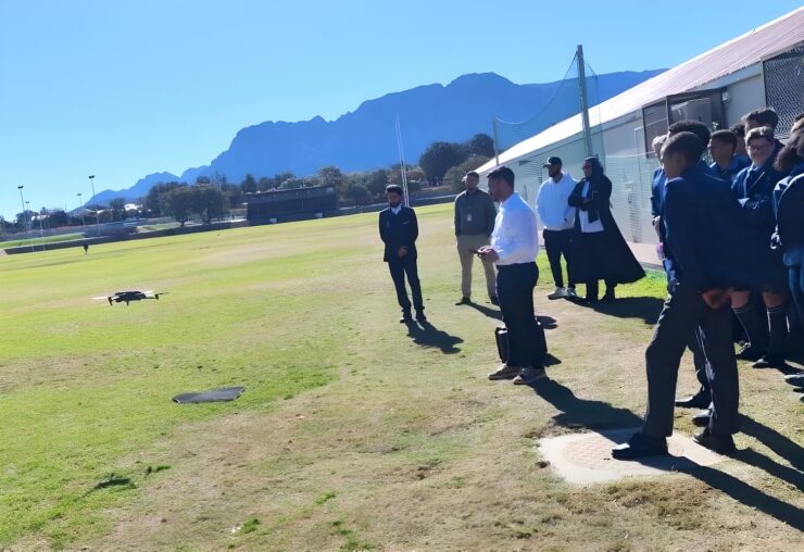 High school students receiving hands-on drone training in the Western Cape